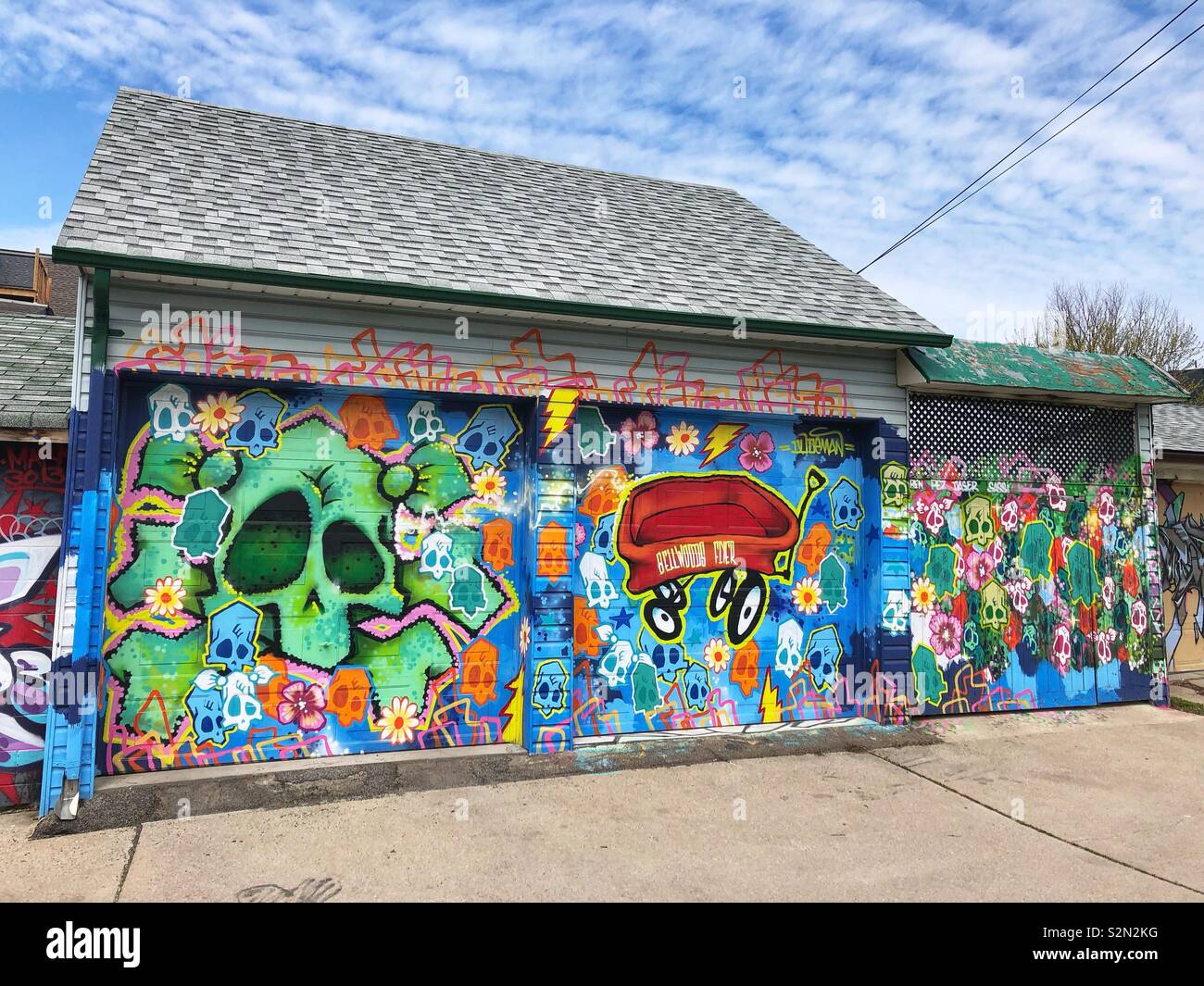 Colourful murals painted on alley garages in Toronto, Canada. - Smartphone Captured Stock Image