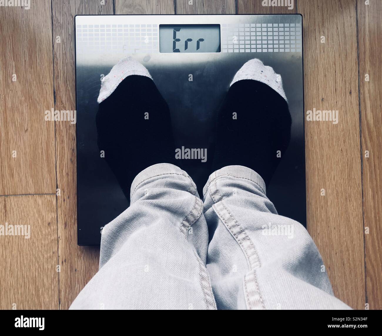 Standing on the bathroom scales and getting an error reading Stock Photo