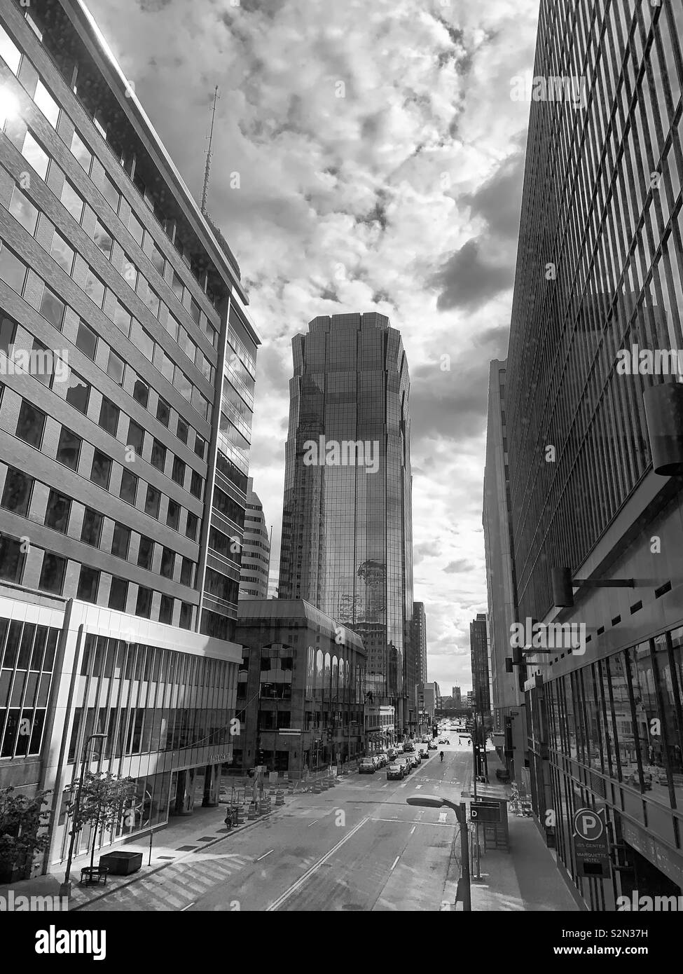 Black and white downtown urban setting with cloud cover. Stock Photo