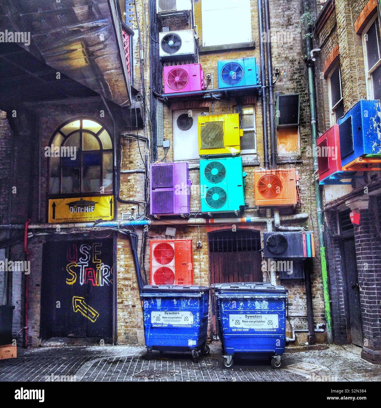 Colourful air conditioning units at the back of a building in London