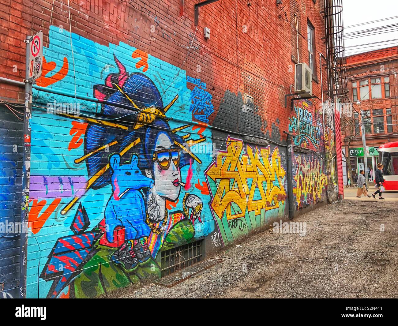 A Toronto street alley with colourful graffiti. - Smartphone Captured Stock Image