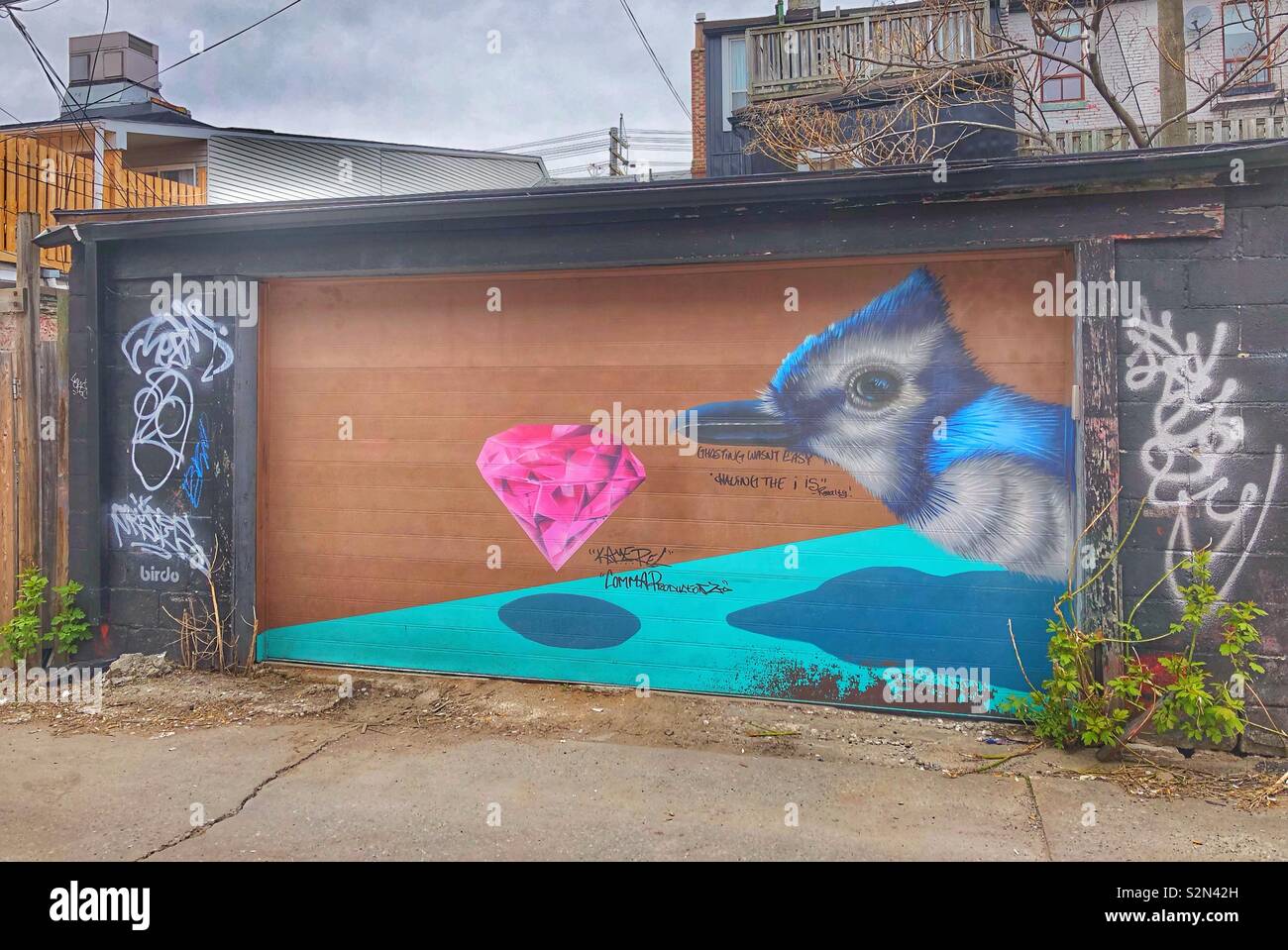 Painted alley garage in a Toronto neighbourhood. - Smartphone Captured Stock Image