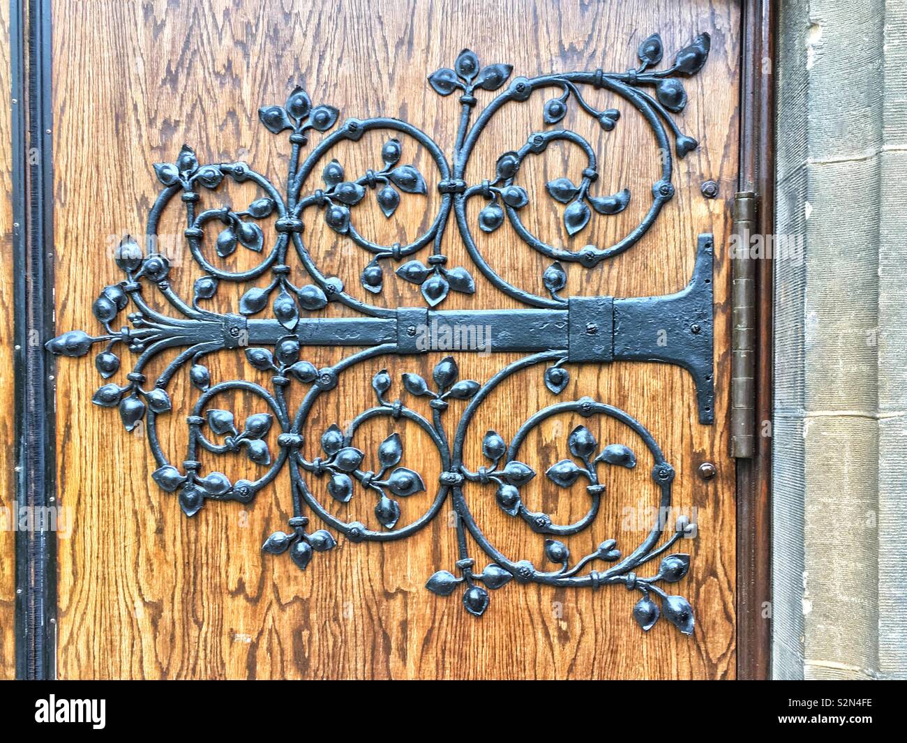 Super fancy and ornate door hinge Stock Photo - Alamy