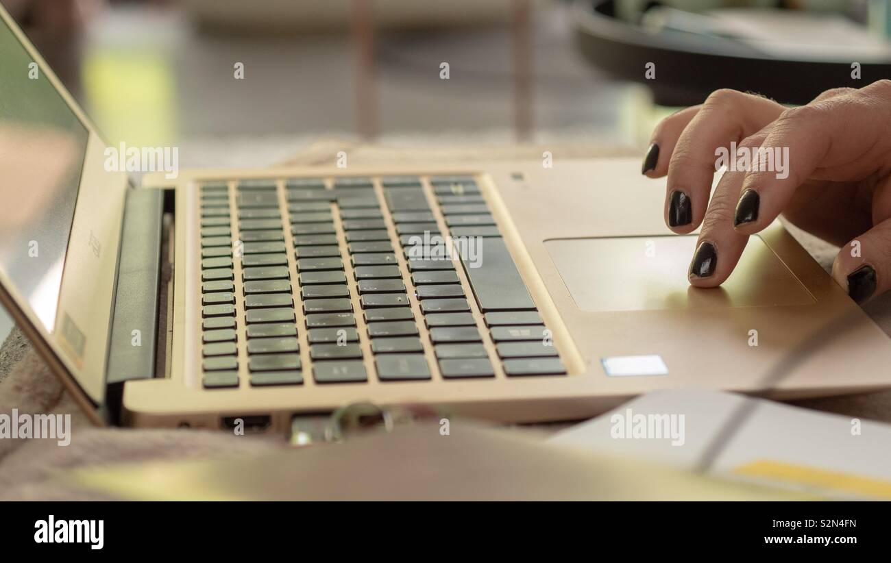 Woman working from home on her laptop - Smartphone Captured Stock Image