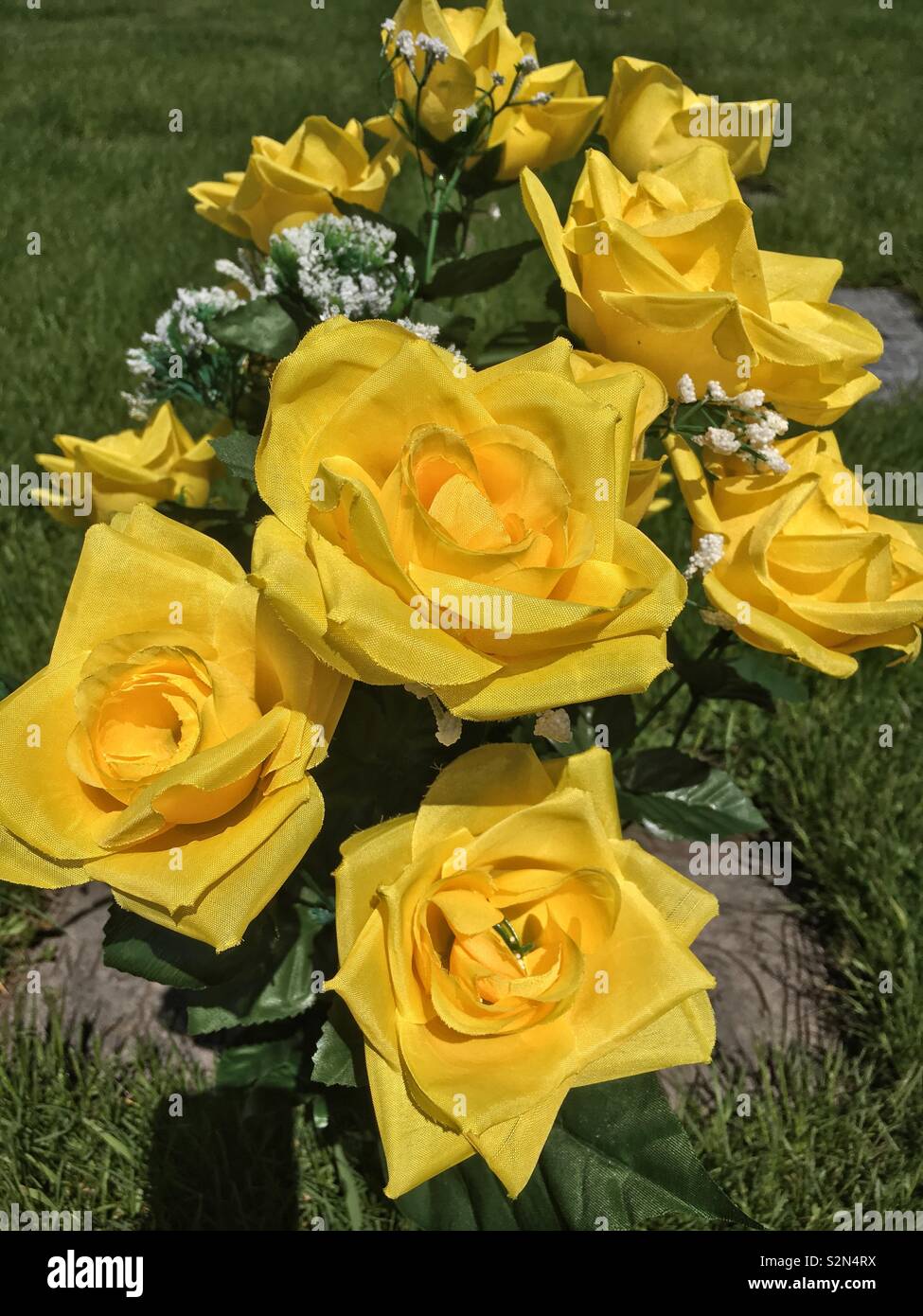 Bouquet of plastic yellow roses. Stock Photo