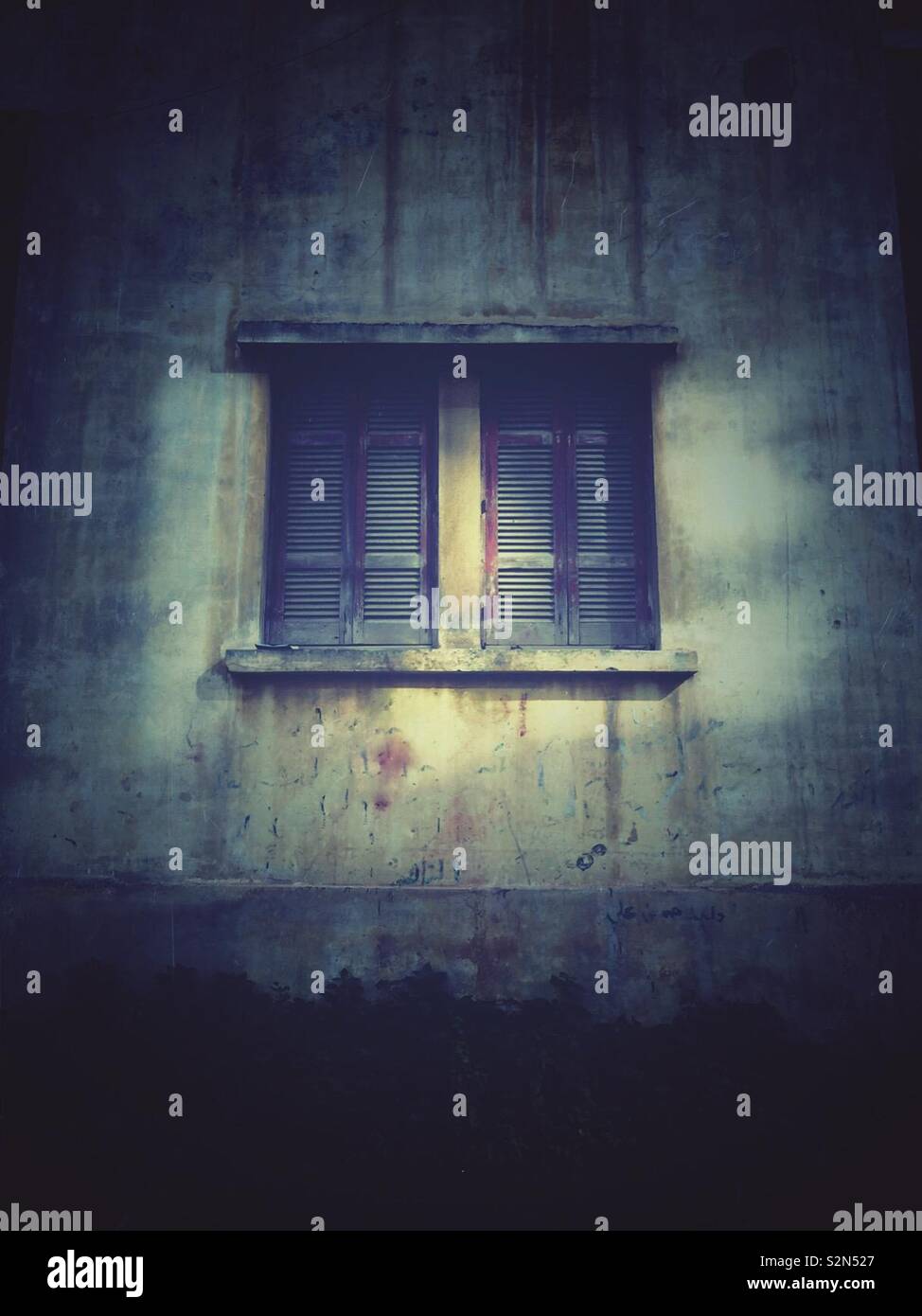 Mysterious window in the dark - Smartphone Captured Stock Image