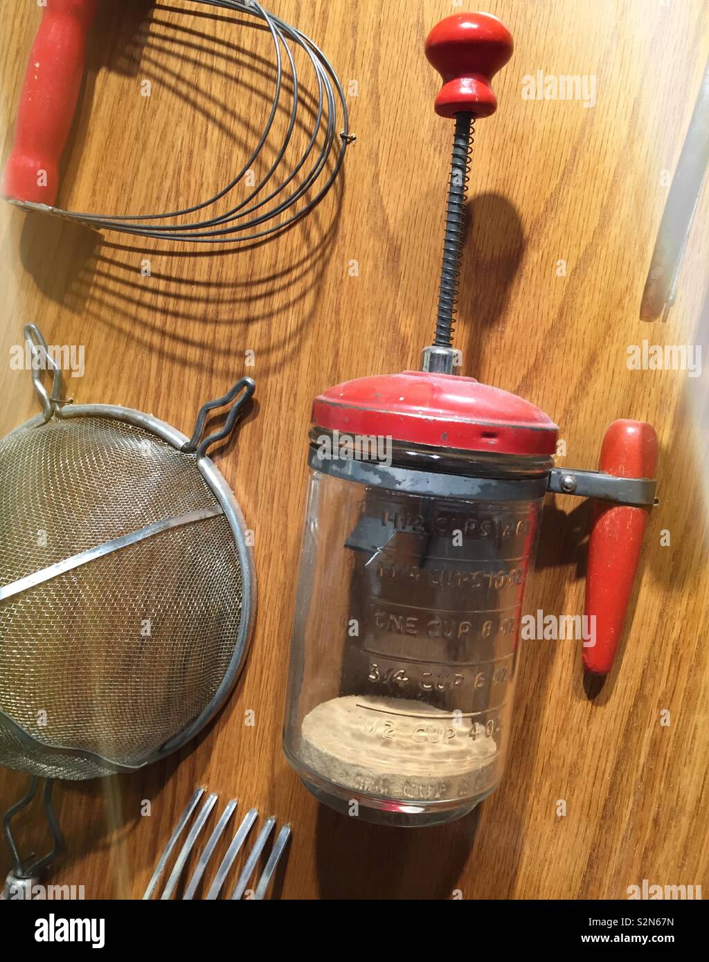 Vintage kitchen utensils on a display board, United States Stock Photo