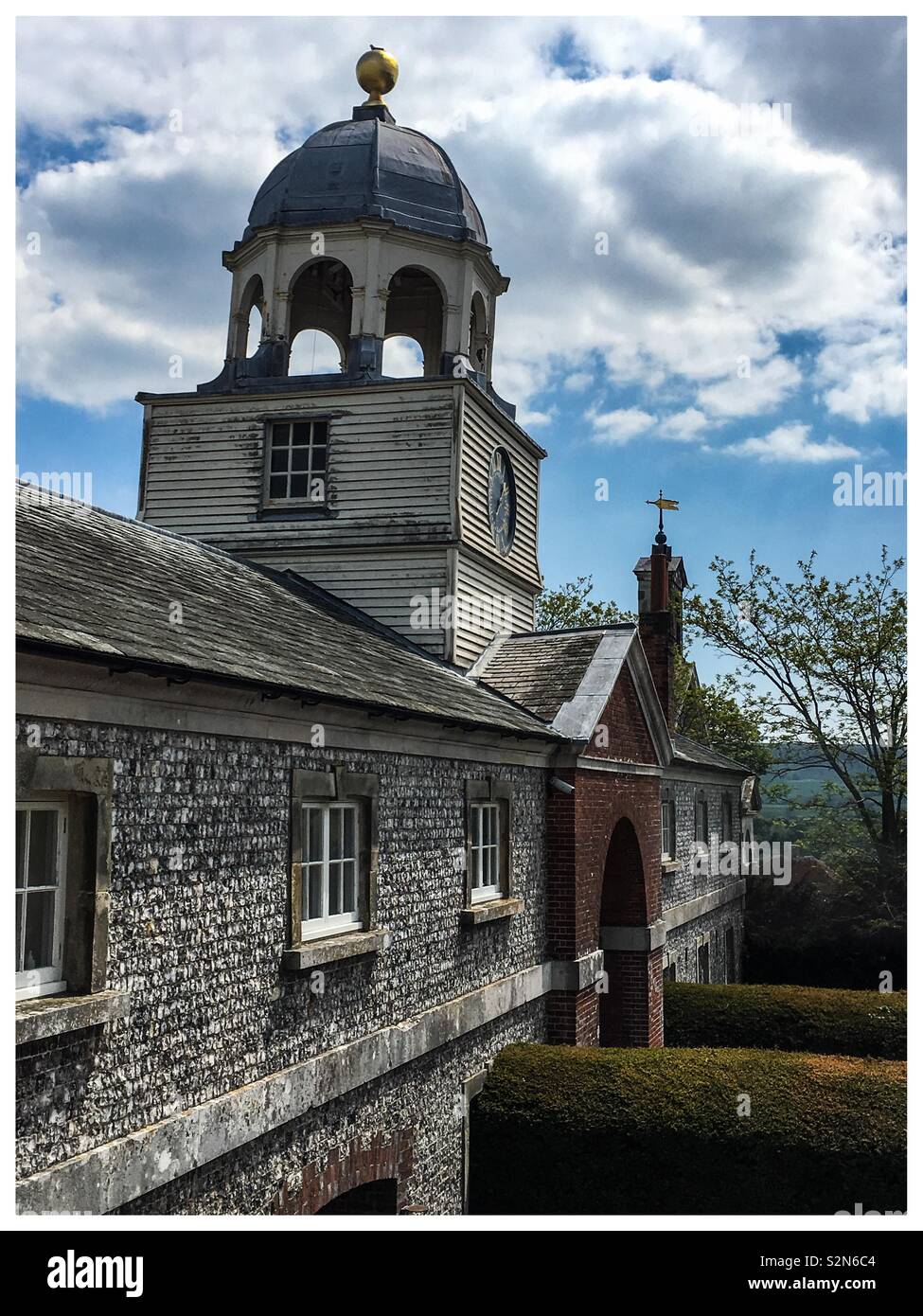 The Clock Tower at Glynde Place, Glynde Village.  The house was built in 1569 and added to over the years. - Smartphone Captured Stock Image