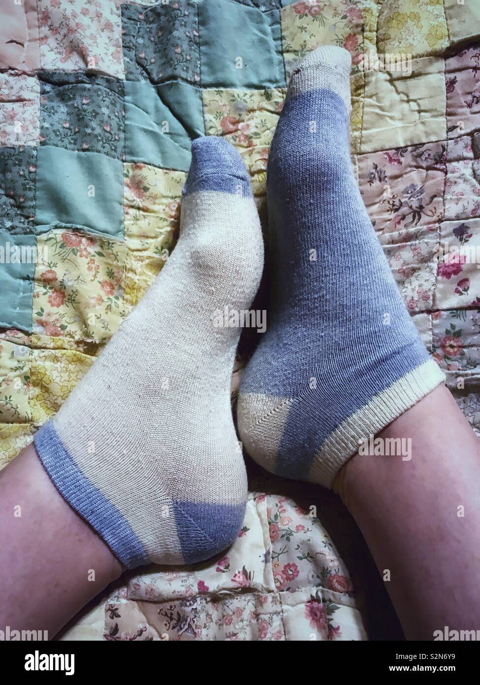 Complementary, but not perfectly matched ankle socks on two feet Stock  Photo - Alamy