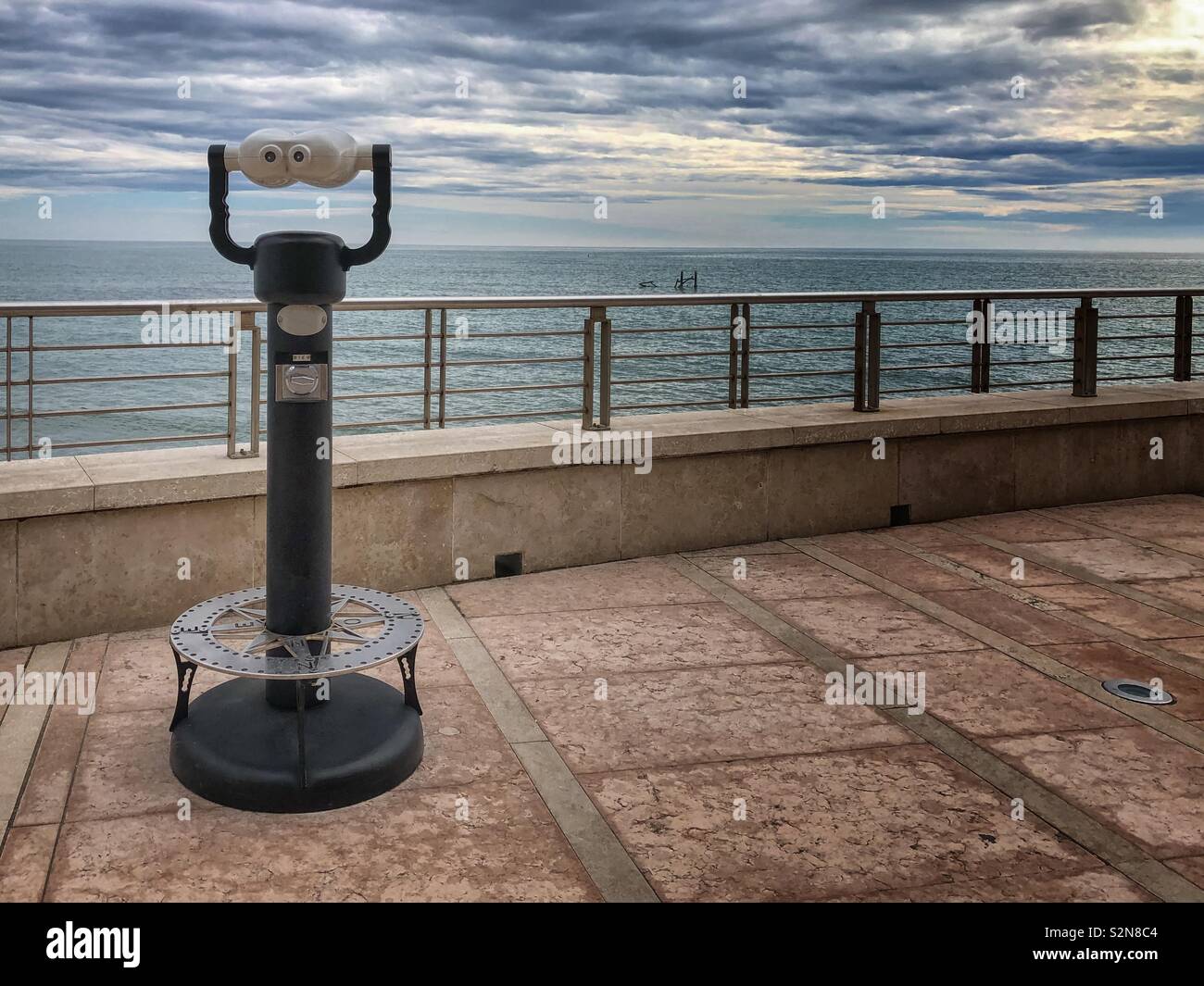 Coin operated binoculars on a terrace at Grado beach, Friuli Venezia Giulia, Italy - Smartphone Captured Stock Image