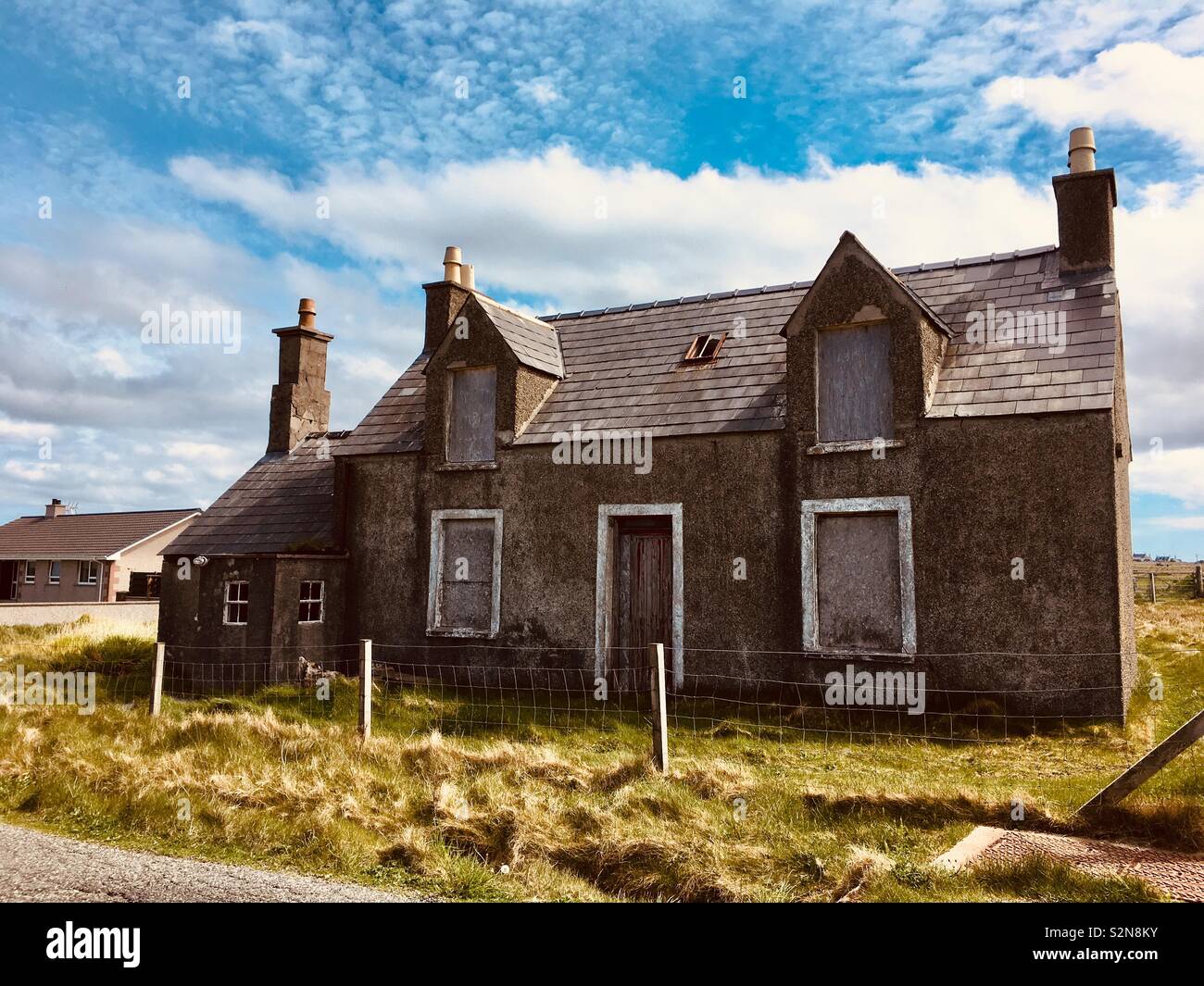 Boarded up derelict house in the Outer Hebrides Stock Photo