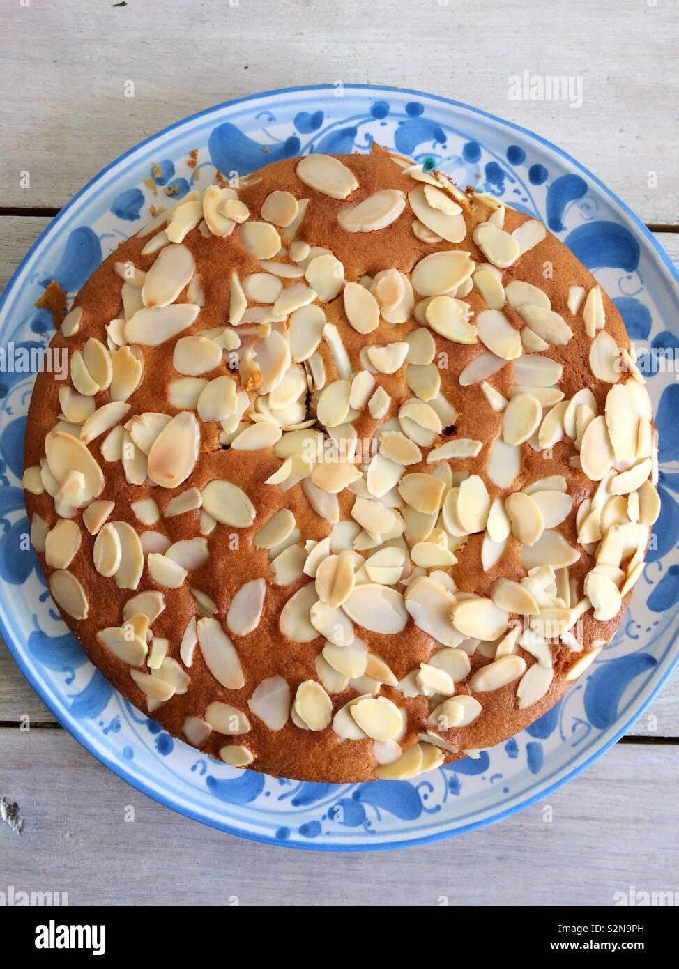 Almond cake on a blue & white plate - Smartphone Captured Stock Image
