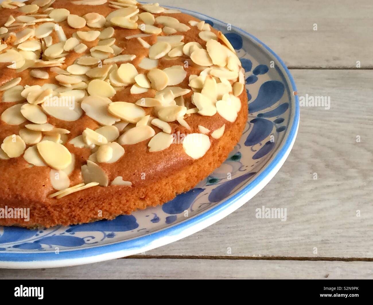 Almond cake on a blue & white plate - Smartphone Captured Stock Image