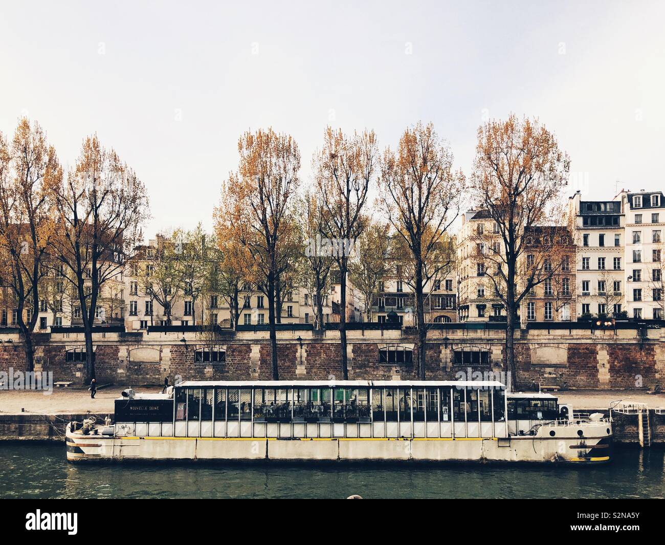 Floating boat restaurant at the bank of the river Seine in Paris - Smartphone Captured Stock Image