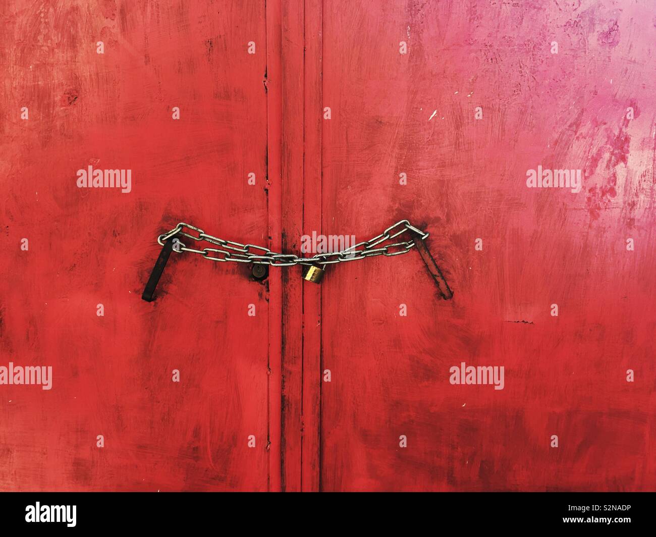 Red gate locked with a chain - Smartphone Captured Stock Image