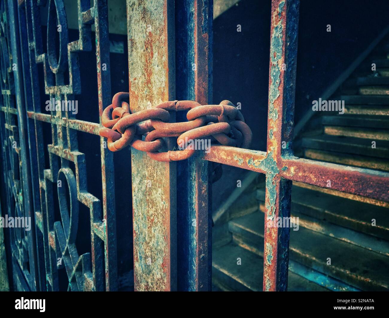 Old metal gate locked with rusty chain - Smartphone Captured Stock Image