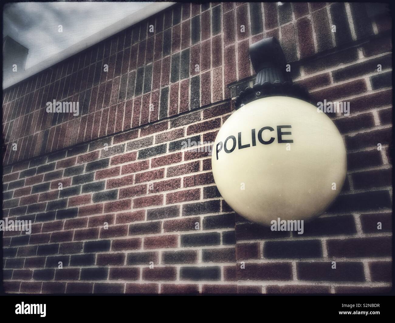 Old style lantern outside of a police station - Smartphone Captured Stock Image