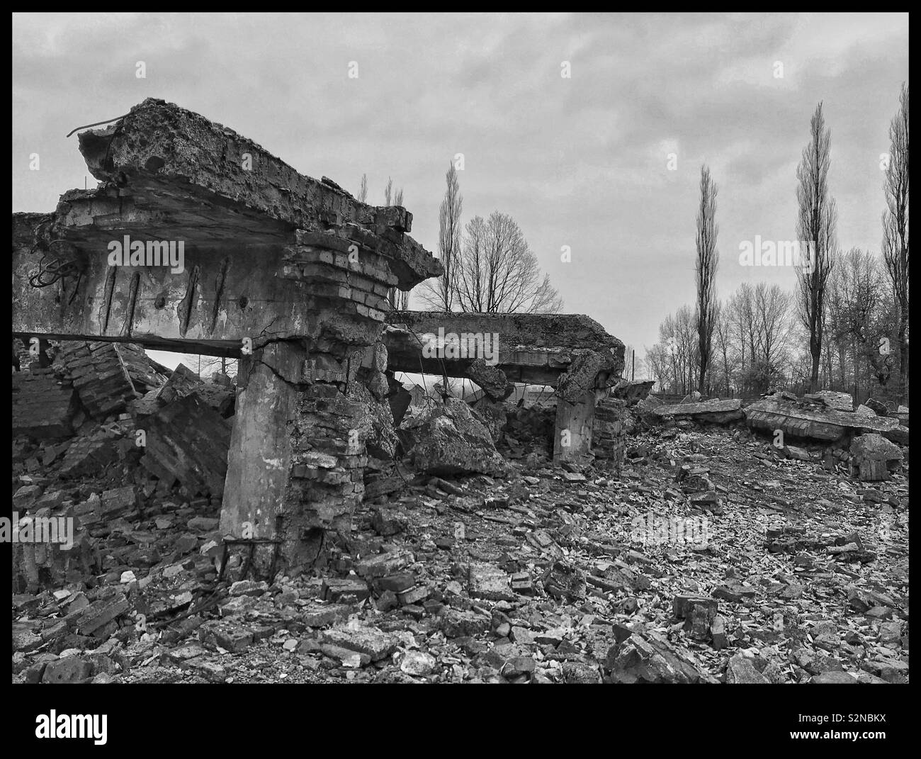 The remains of a gas chamber at the Nazi Auschwitz II-Birkenau Concentration Camp. Shortly before the camp was liberated by Russian Forces in 1945, the Nazis tried to destroy Auschwitz. Now a Memorial - Smartphone Captured Stock Image