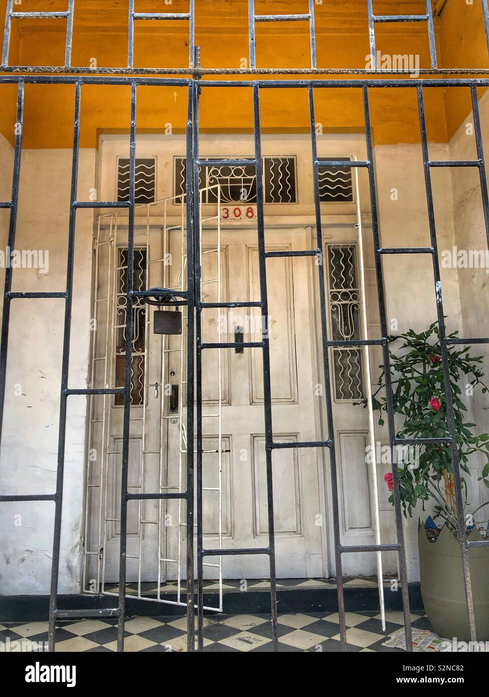 The gated entrance to a colonial building in Old Town Santa Marta, Colombia. Stock Photo