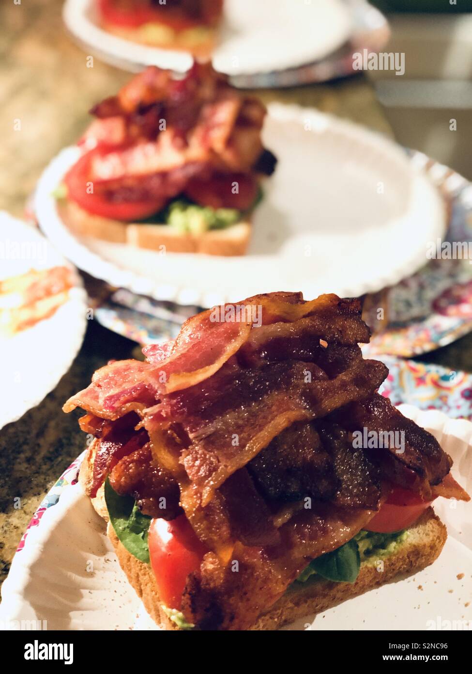 Easy dinner, bacon lettuce tomato sandwiches with avocado for foodies - Smartphone Captured Stock Image