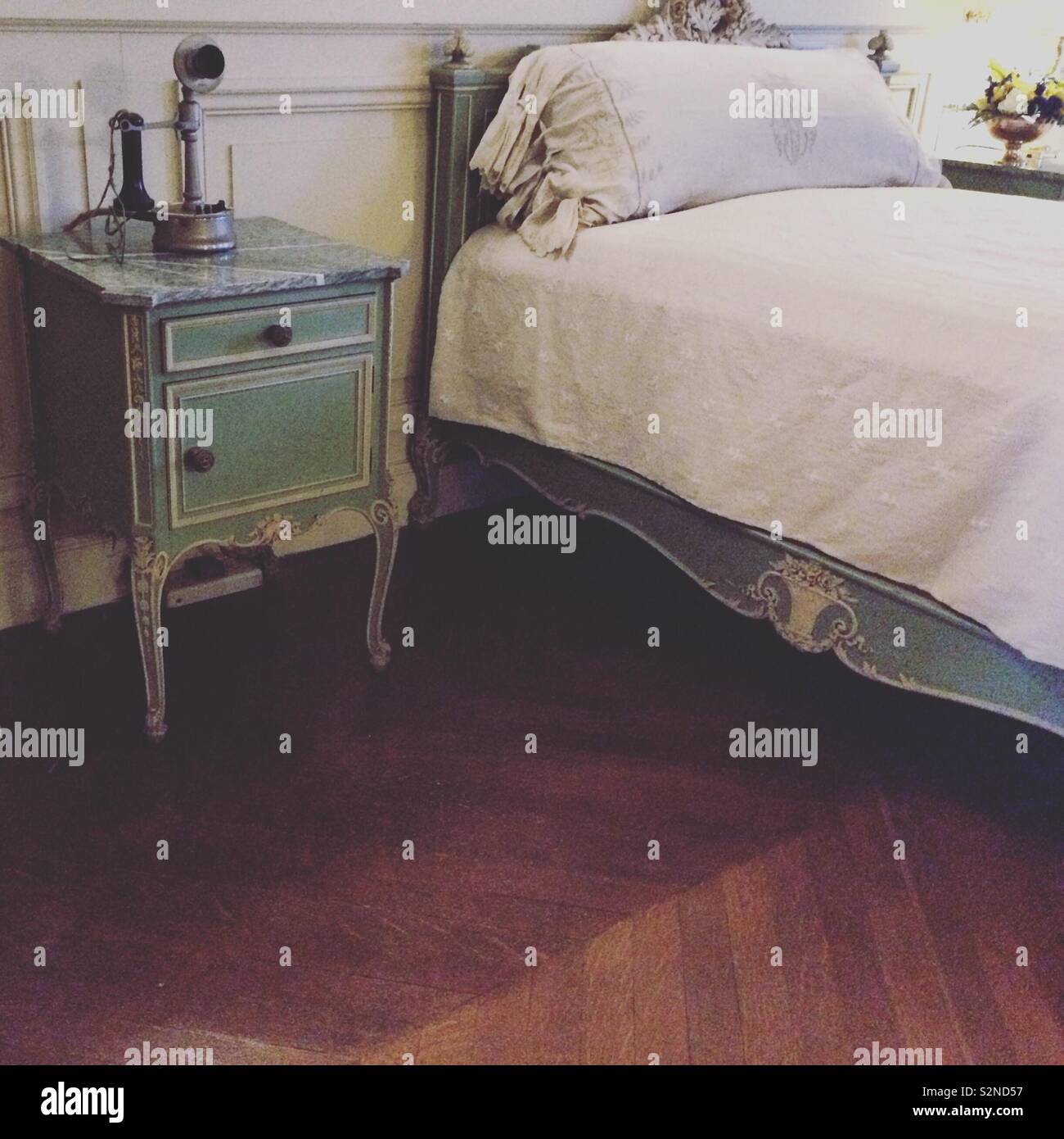 Bedroom furnishings and telephone, The Breakers mansion, Newport, Rhode Island, United States - Smartphone Captured Stock Image