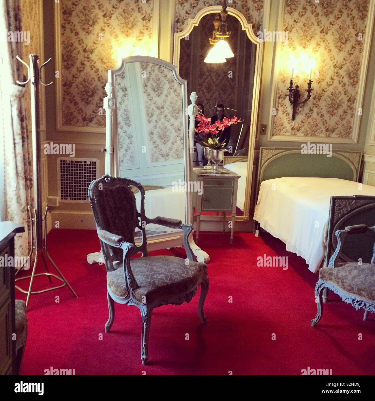 A bedroom at The Breakers mansion, Newport, Rhode Island,United States - Smartphone Captured Stock Image