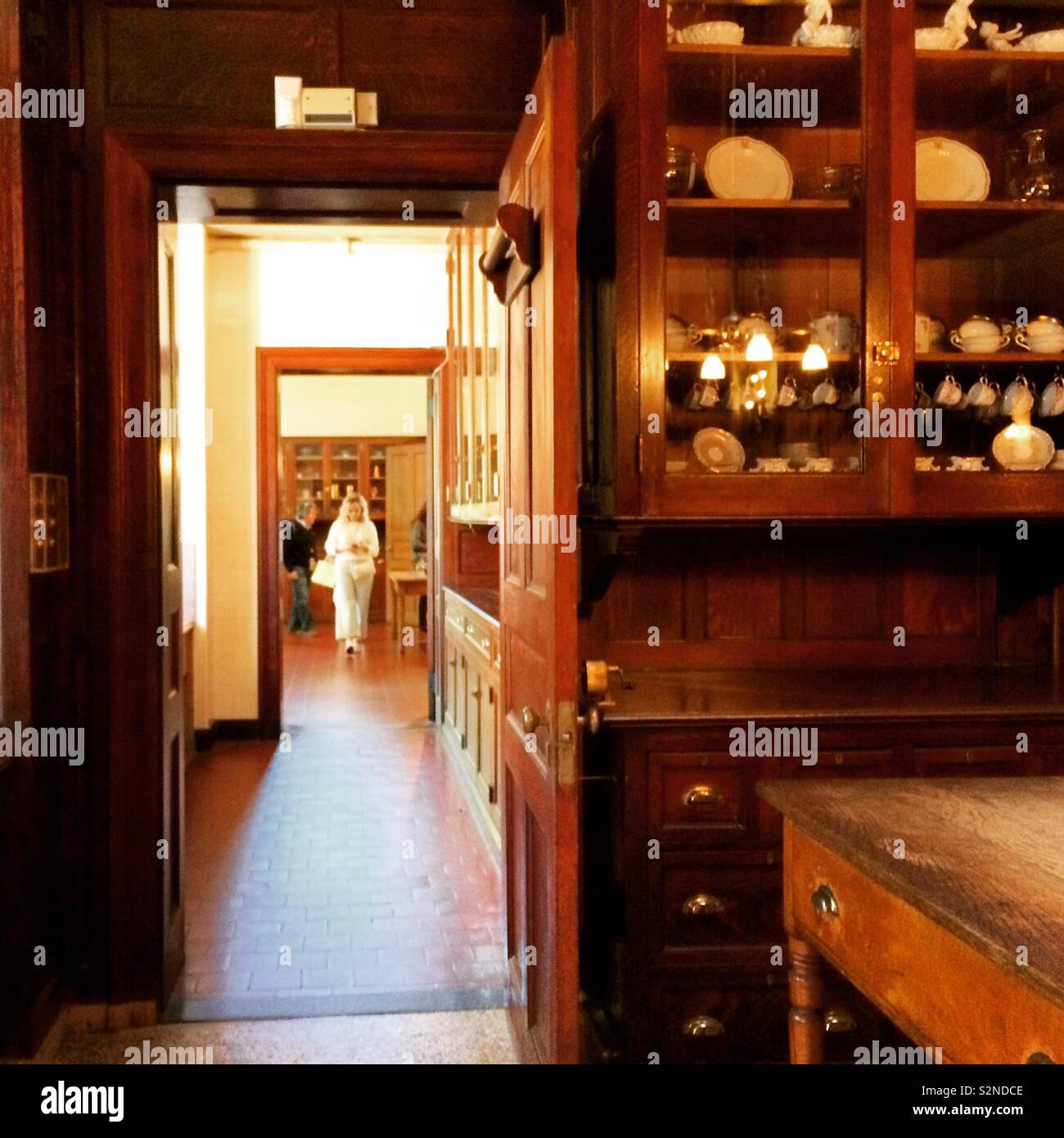 Looking through open doors from the pantry at The Breakers mansion, Newport, Rhode Island, United States - Smartphone Captured Stock Image