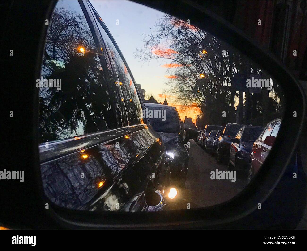 Reflection on rear view mirror - Smartphone Captured Stock Image