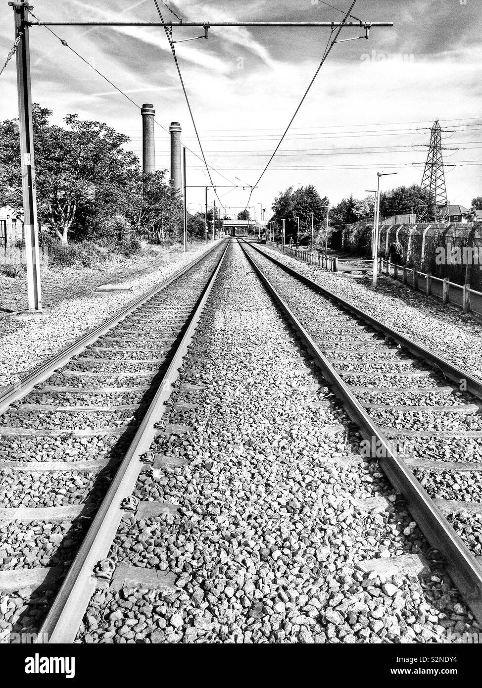 Converging lines, rails and tramway power cables, in the suburbs of ...