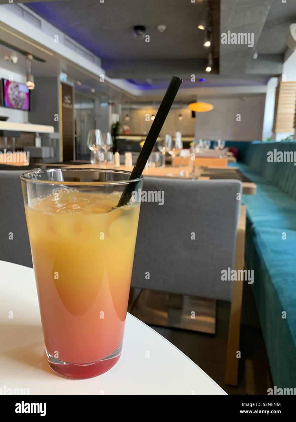 Colorful glass of cocktail in a modern restaurant - Smartphone Captured Stock Image