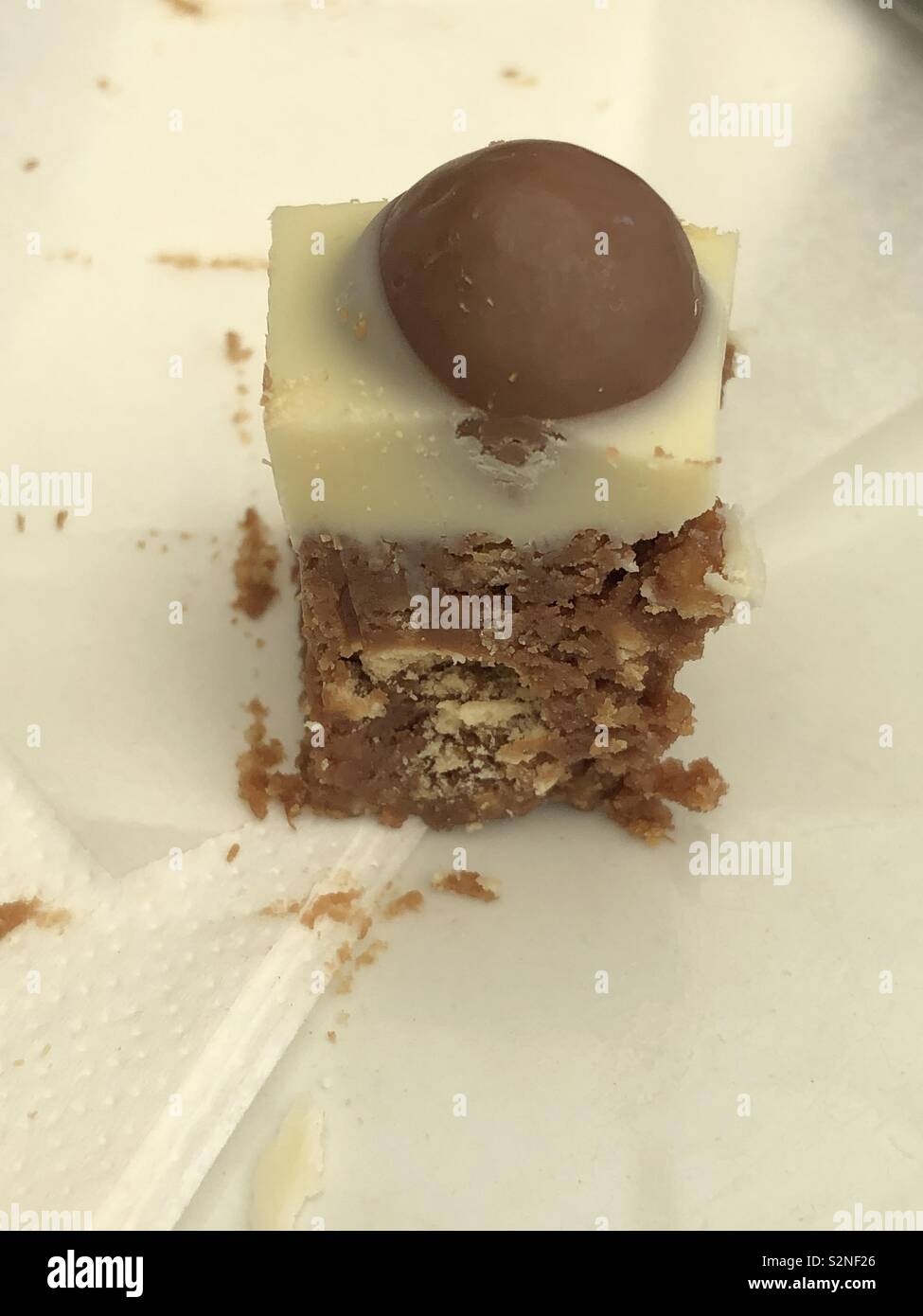 Small mouthful of Malteser tray bake cake Stock Photo