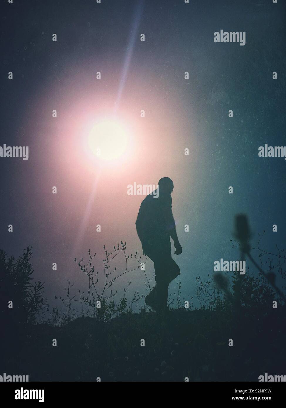 Mysterious male figure walking away - Smartphone Captured Stock Image