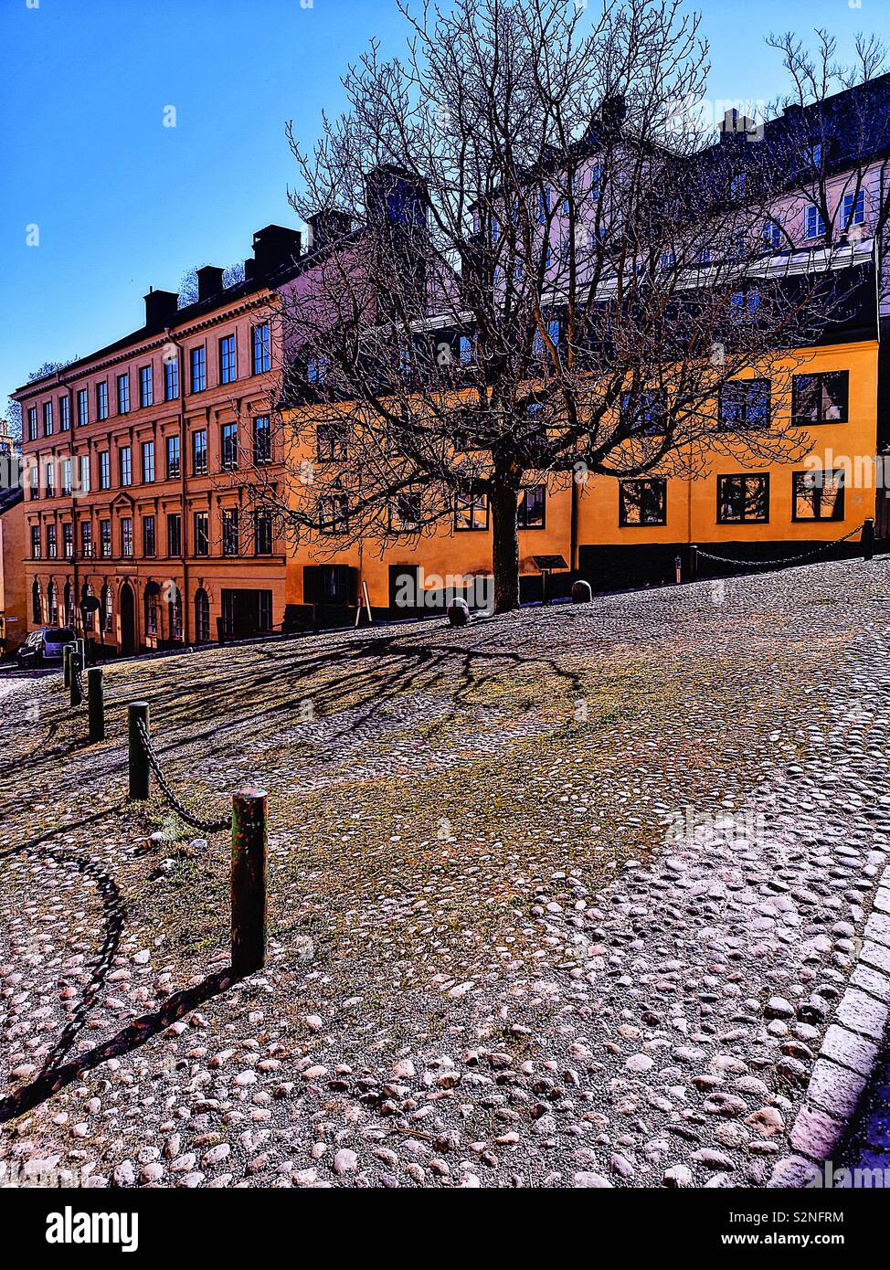 Small triangular cobbled Square where Bastugatan meets Pryssgrand, Sodermalm, Stockholm, Sweden, Scandinavia. Well preserved 18th century houses - Smartphone Captured Stock Image