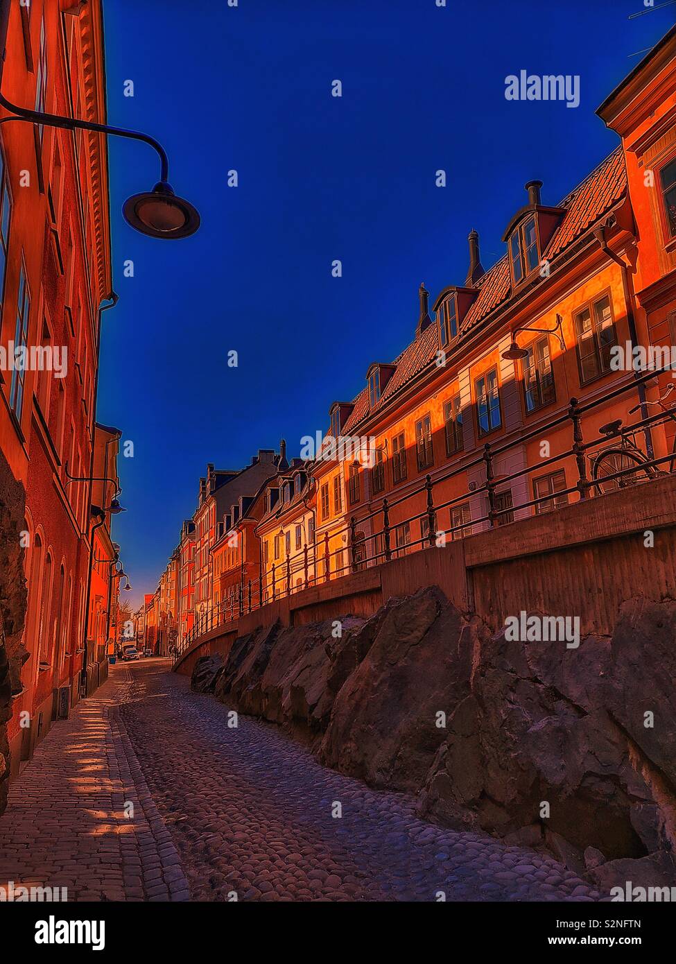 Dusk on Brannkyrkagatan, Sodermalm, Stockholm, Sweden, Scandinavia. The hump known as an Apparel is an elevation of part of the street, here called Lilla Puckeln and built in 1885 - Smartphone Captured Stock Image