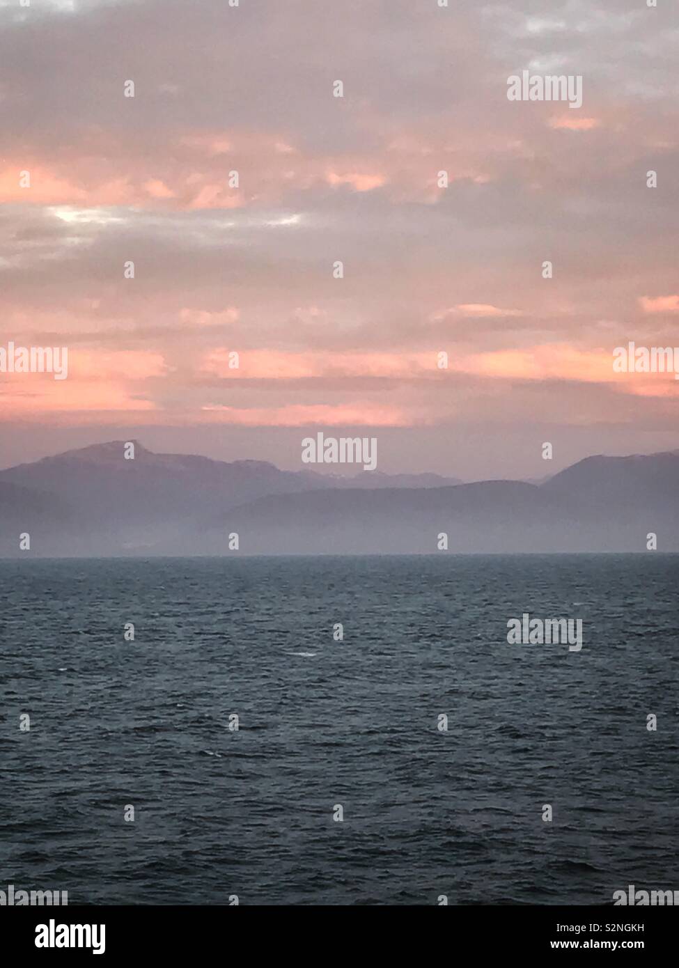 Sunset at the long white cloud.... - Smartphone Captured Stock Image