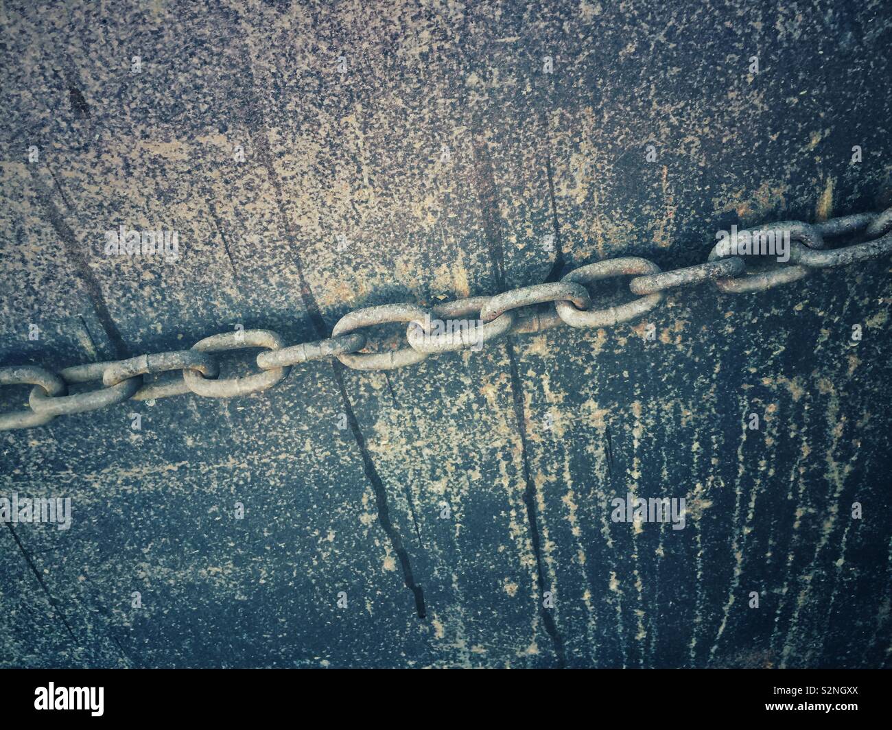 Metal chain against grungy background - Smartphone Captured Stock Image