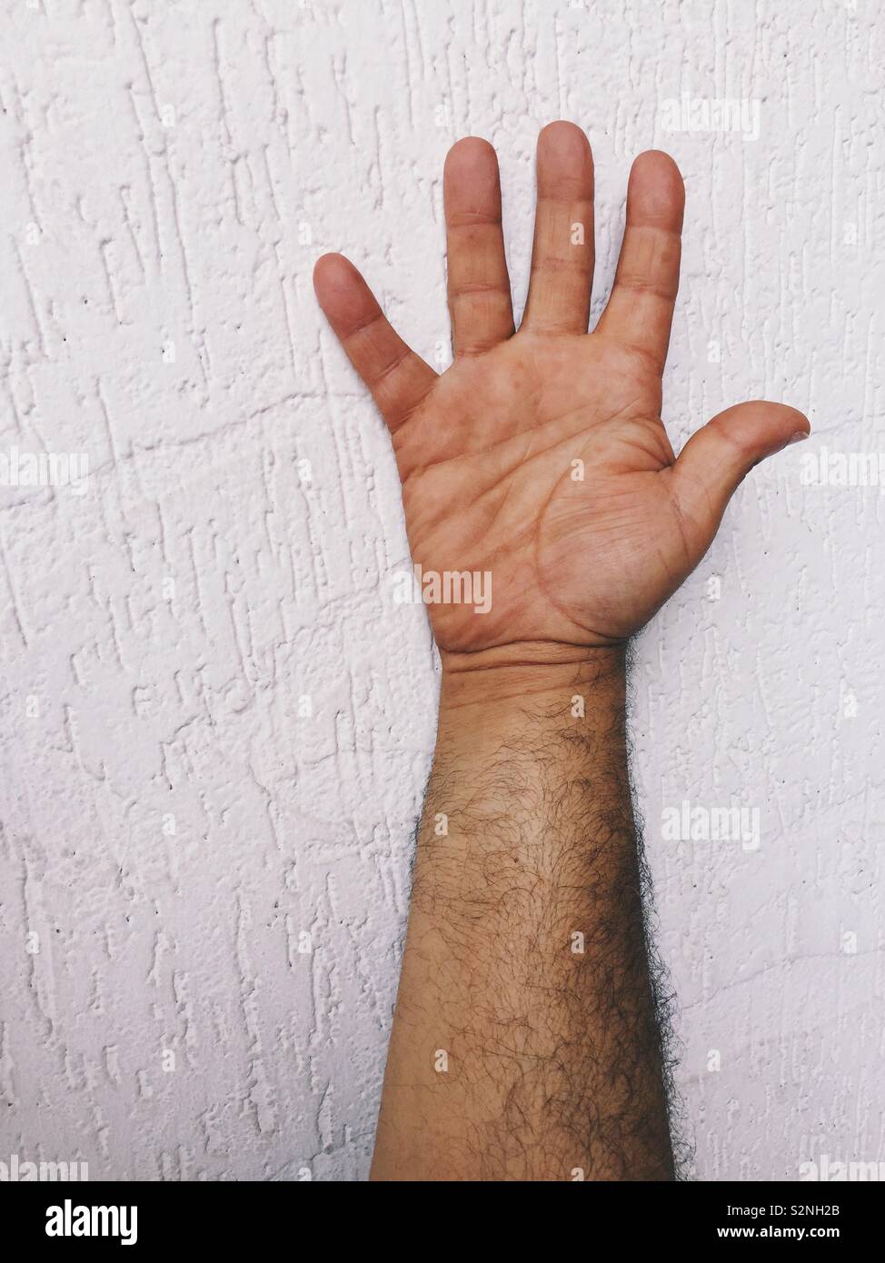 Close up of a senior man’s hand - Smartphone Captured Stock Image