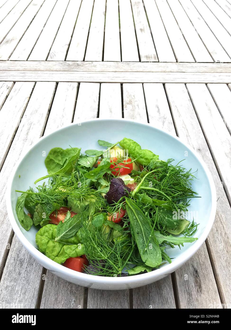 Fresh baby salad in a white bowl - Smartphone Captured Stock Image