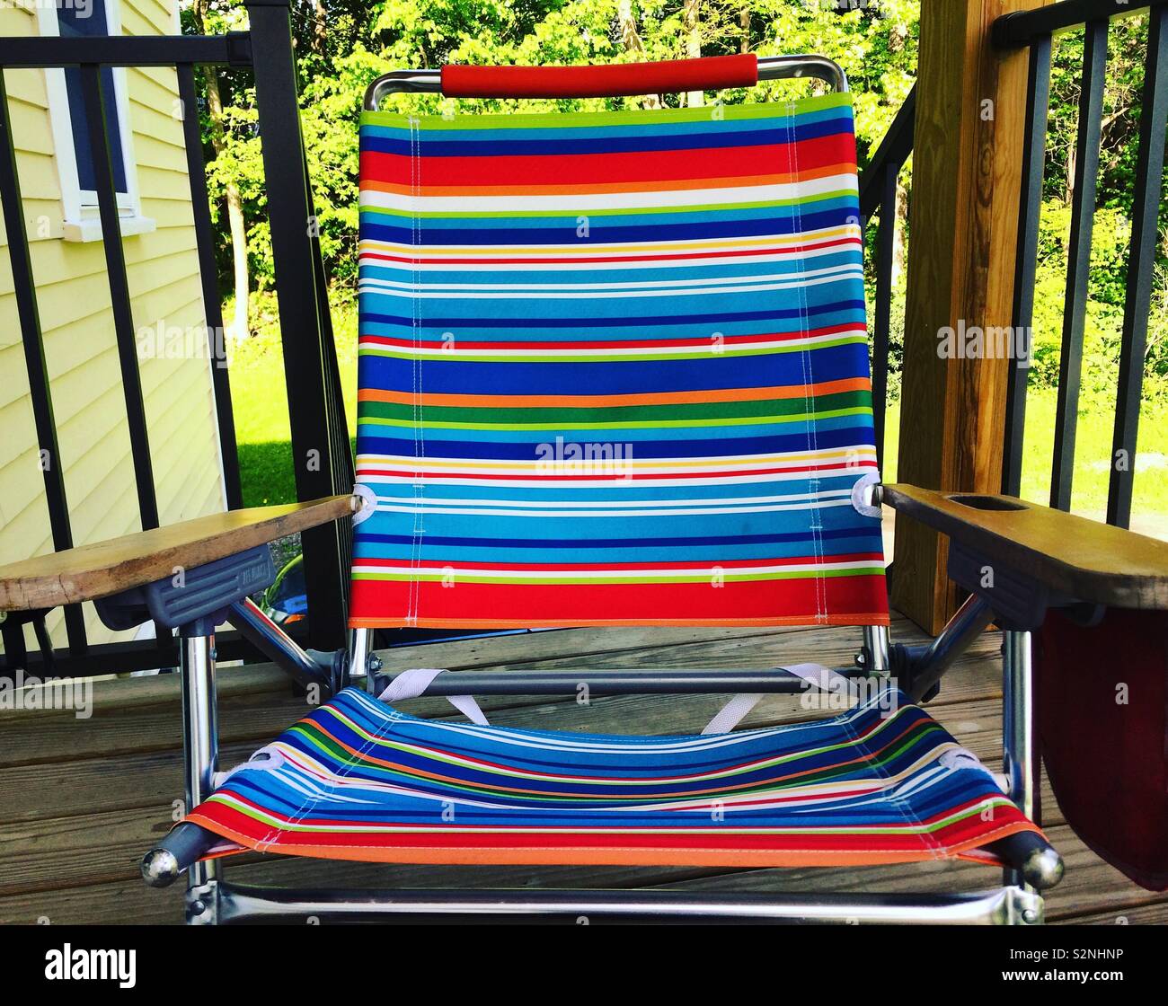 Colorful beach chair on a porch - Smartphone Captured Stock Image