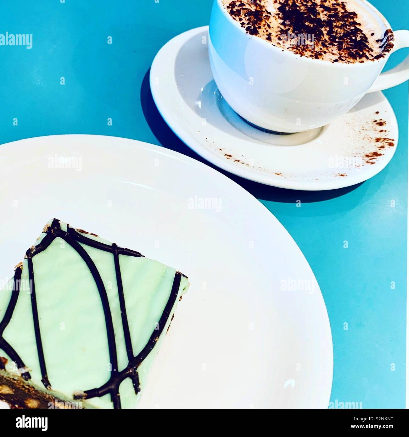 Mid-afternoon cappuccino and mint tiffin break at The Place To Eat in John Lewis, Liverpool. Stock Photo