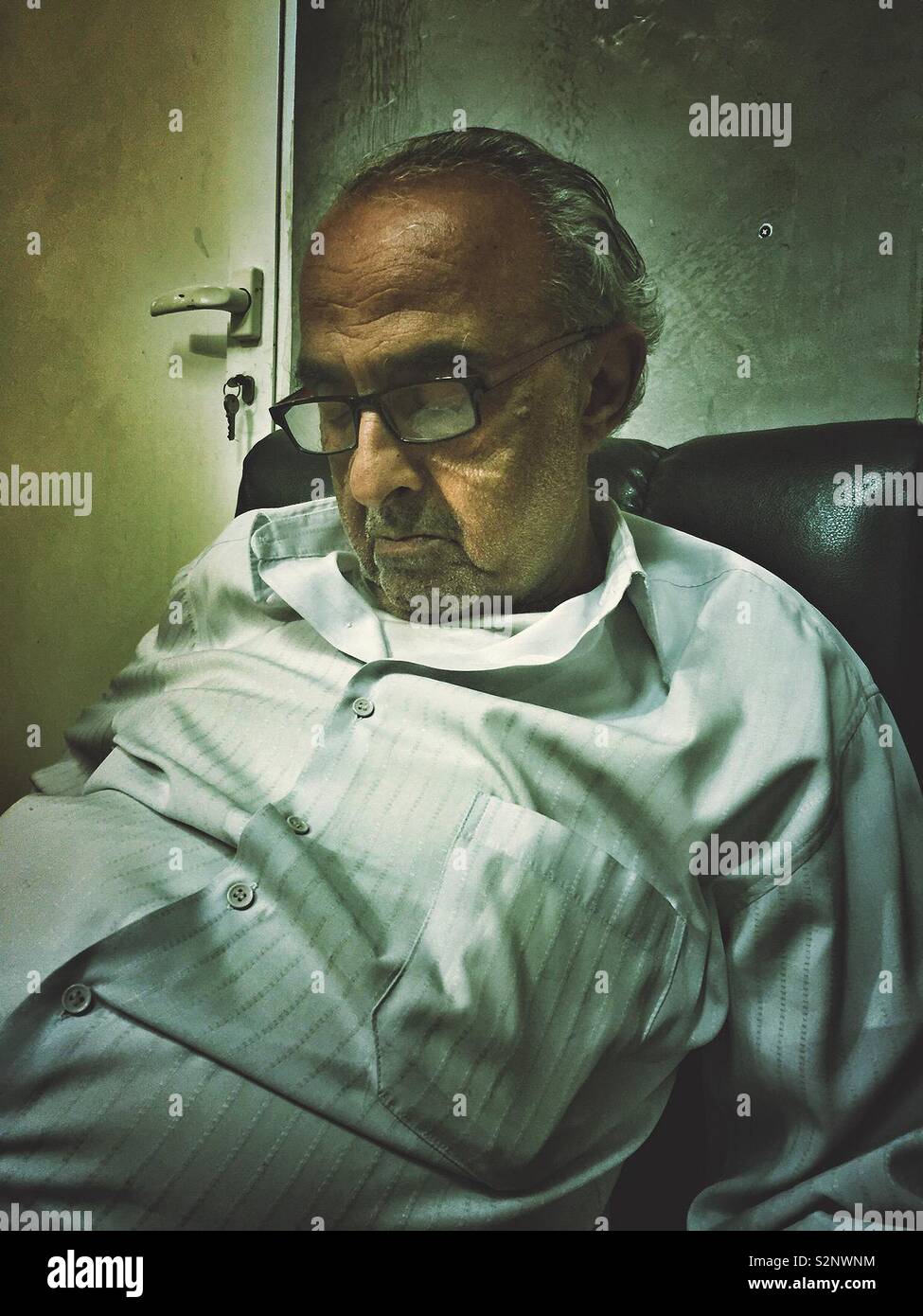 Old man sleeping on the couch - Smartphone Captured Stock Image