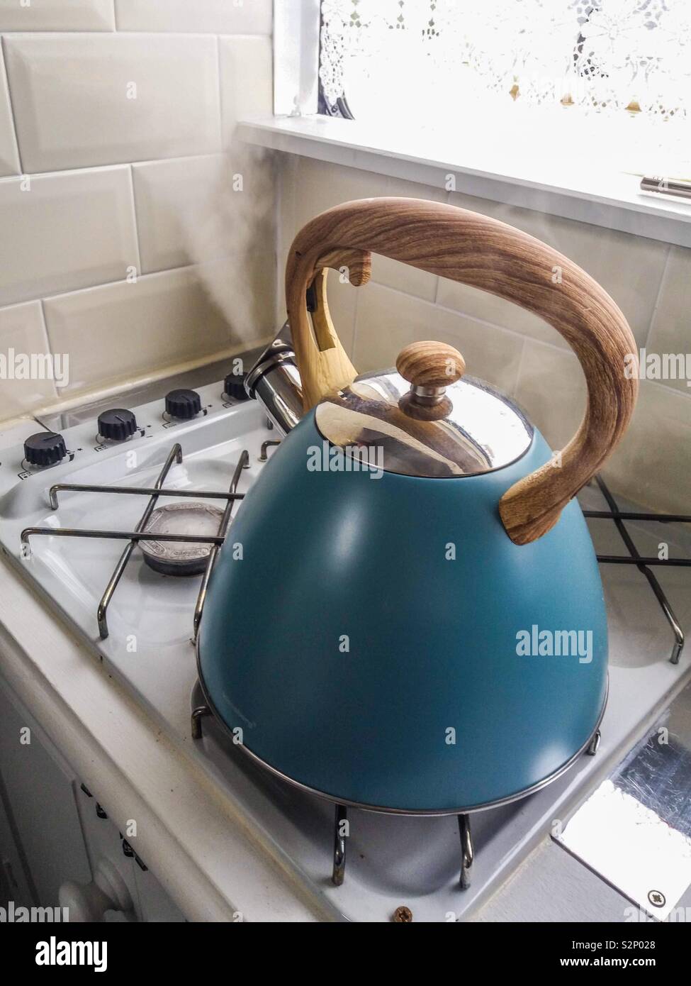Boiling a whistling kettle Stock Photo Alamy