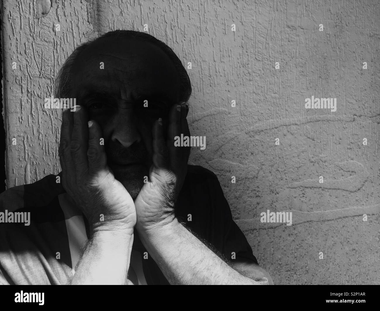 Old man head in hands - Smartphone Captured Stock Image