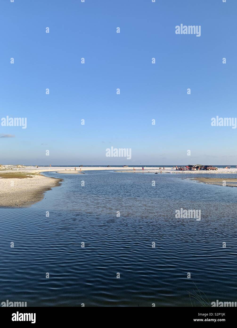 Coastal dune lake, rare and unique ecosystem, environment, blue skies, blue water, people, scenic view - Smartphone Captured Stock Image