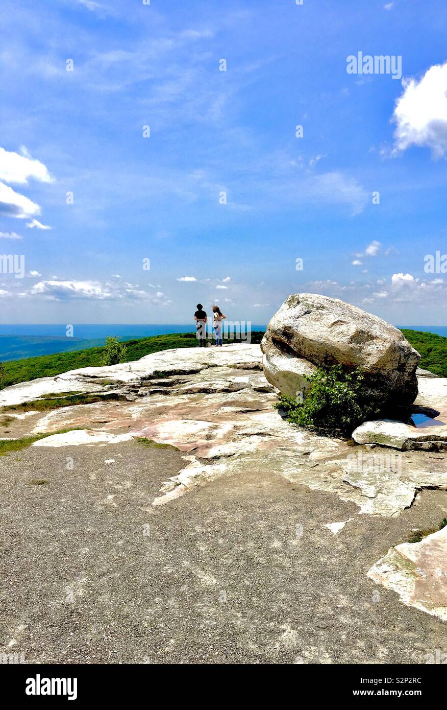 Hiking couple admiring vista Gertrude’s Nose Shawanagunks New Paltz New York State Stock Photo