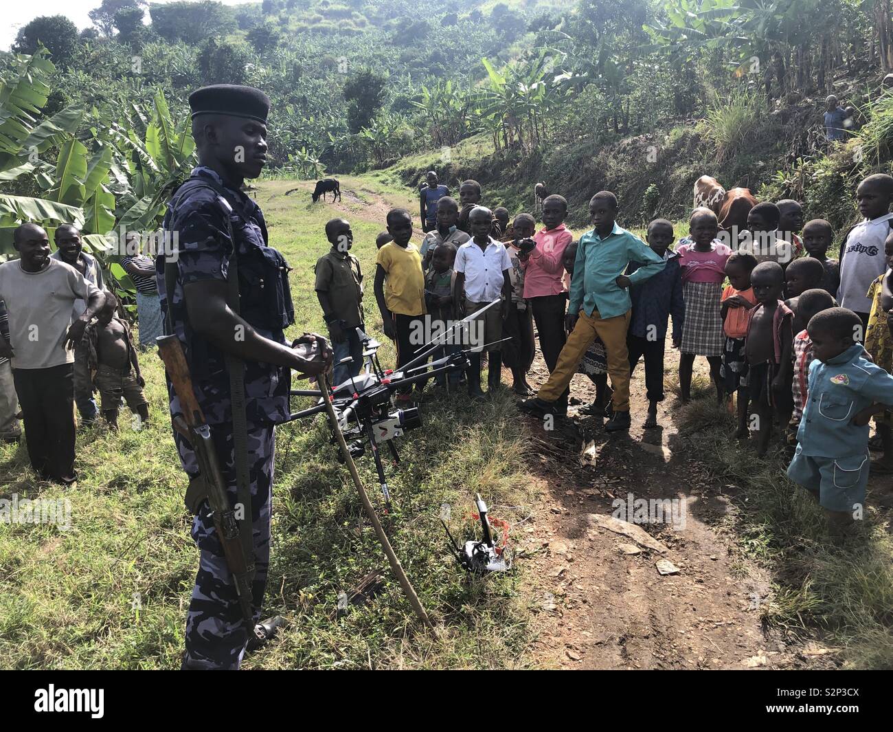 Police officers in Uganda educate children on drones Stock Photo