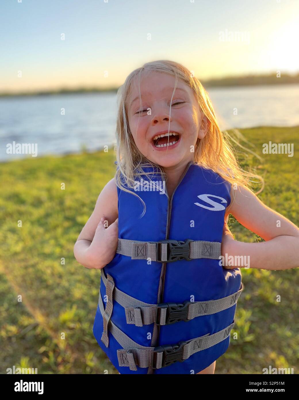 Young child wearing a life jacket at the lake Stock Photo Alamy