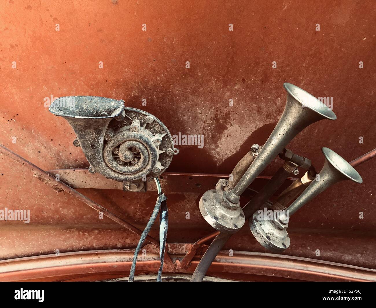 Farm truck air horns ready attached to inside hood Stock Photo Alamy