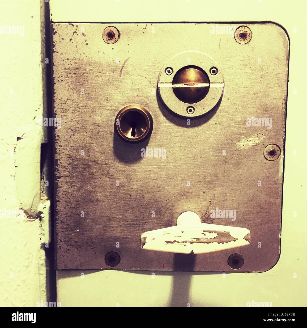 Prison cell door handle and lock at the Clink78 hostel, Kings Cross, London, England. - Smartphone Captured Stock Image