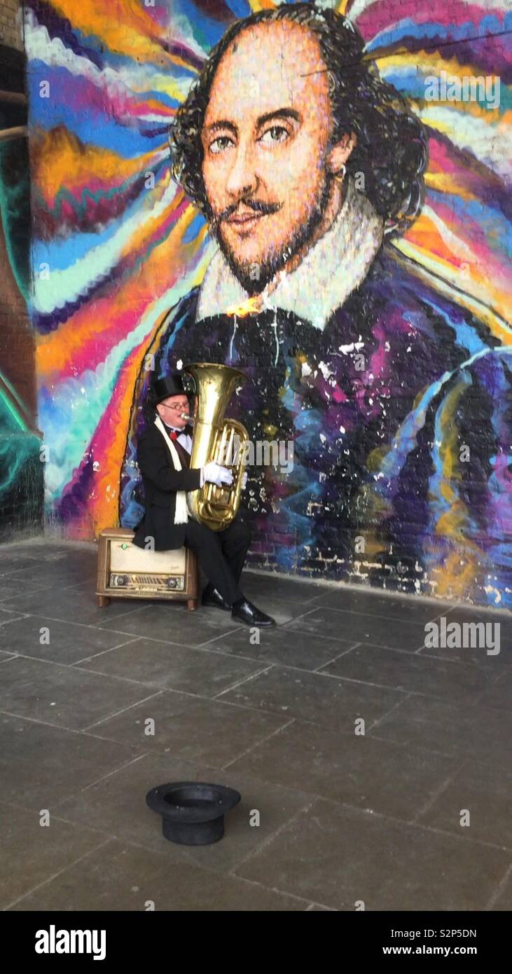 Shakespeare colourful graffiti with fire euphonium player May 2019 Stock Photo